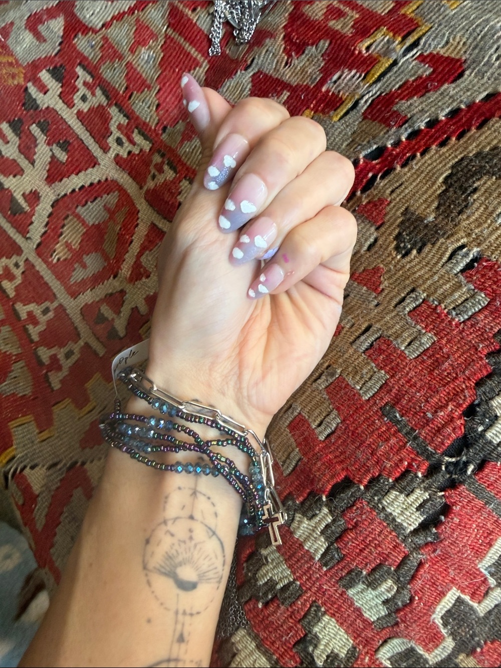 Free People iridescent blue-purple beaded bracelet with silver cross jewelry
